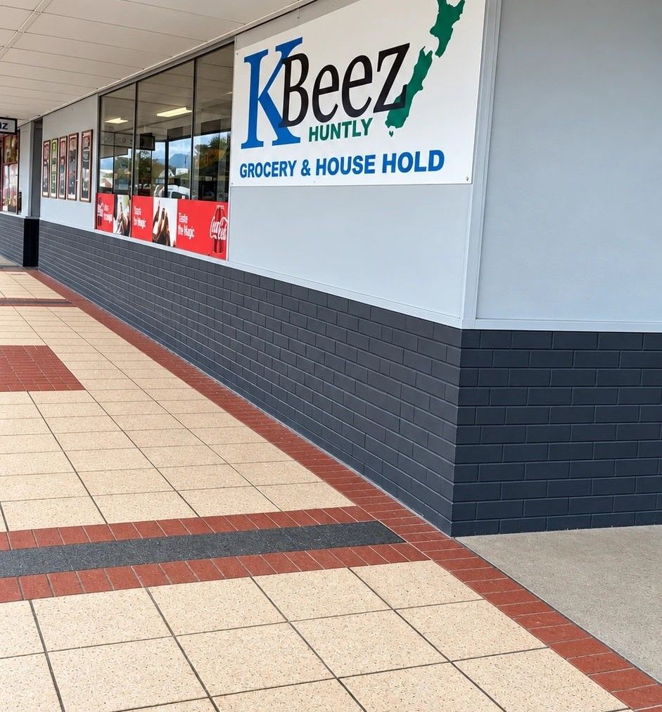 The KBeez shopfront on Main Street, Huntly, with its familiar sign, pale blue wall and navy tiles.